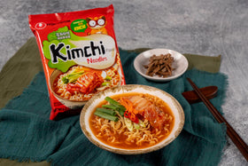 Nongshim sauce packet with vegetables for a complete ramen dish.