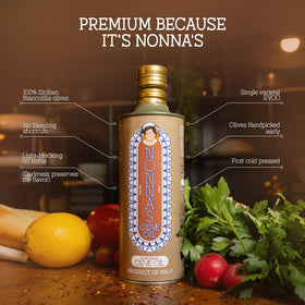 Nonna's Olive Oil in a glass bottle on a kitchen counter