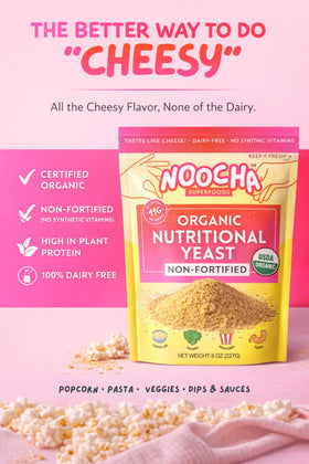Pouring Noocha flakes from a shaker to sprinkle on foods.