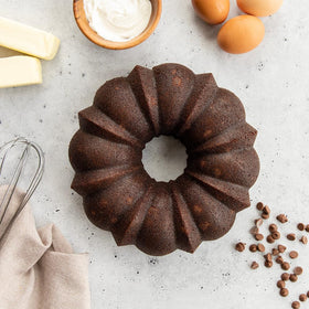 Nordic Ware Bundt cake mix bowl and spoons display simple kitchen prep