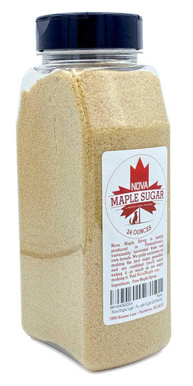 Nova Maple Sugar granules on a spoon ready to sweeten yogurt or oats.