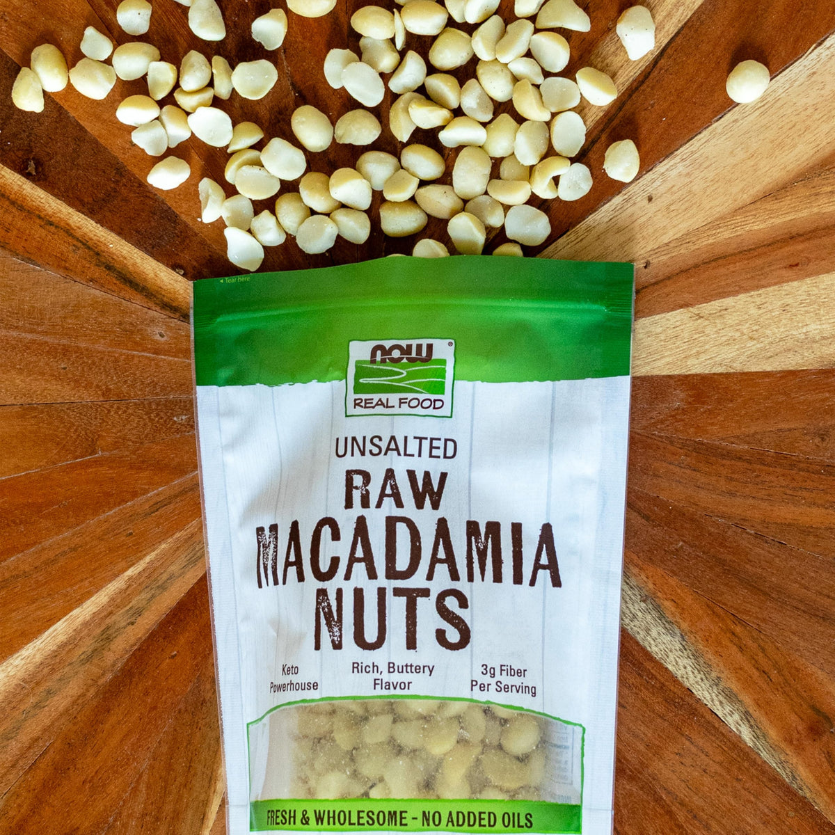NOW Foods raw macadamias packaging close-up, USA-made in a family-owned facility.