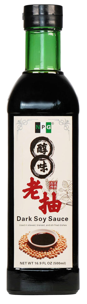NPG Premium Dark Soy Sauce bottle on table for rich flavor.