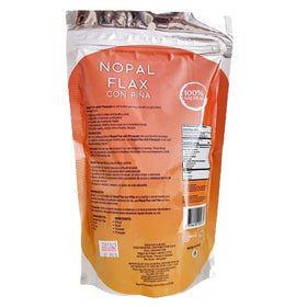 Spoon pouring Nuestra NS Salud Nopal Flax Plus Pineapple powder into a smoothie for fiber boost.