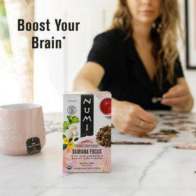 Numi Damiana Focus dry herbs close-up shows vibrant damiana, hibiscus, and peppermint.