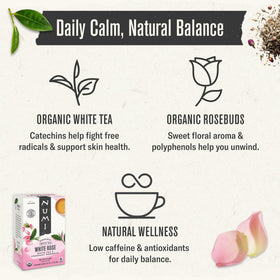 Arrangement of rose buds and white tea leaves, organic ingredients