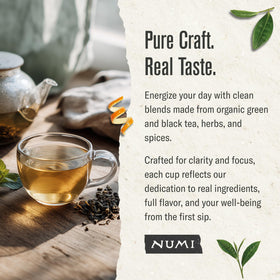 Numi tea leaves in a wooden scoop suggest mindful traditional brewing.