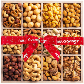 Nut Cravings 12-nuts selection on a wooden tray for shared snacking
