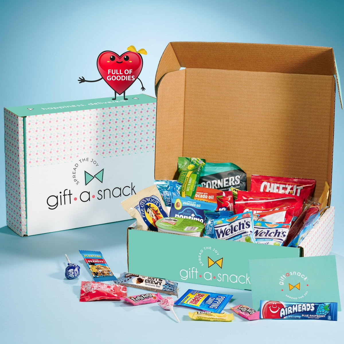 Nut Cravings Gift A Snack box open, showcasing a diverse snack lineup.