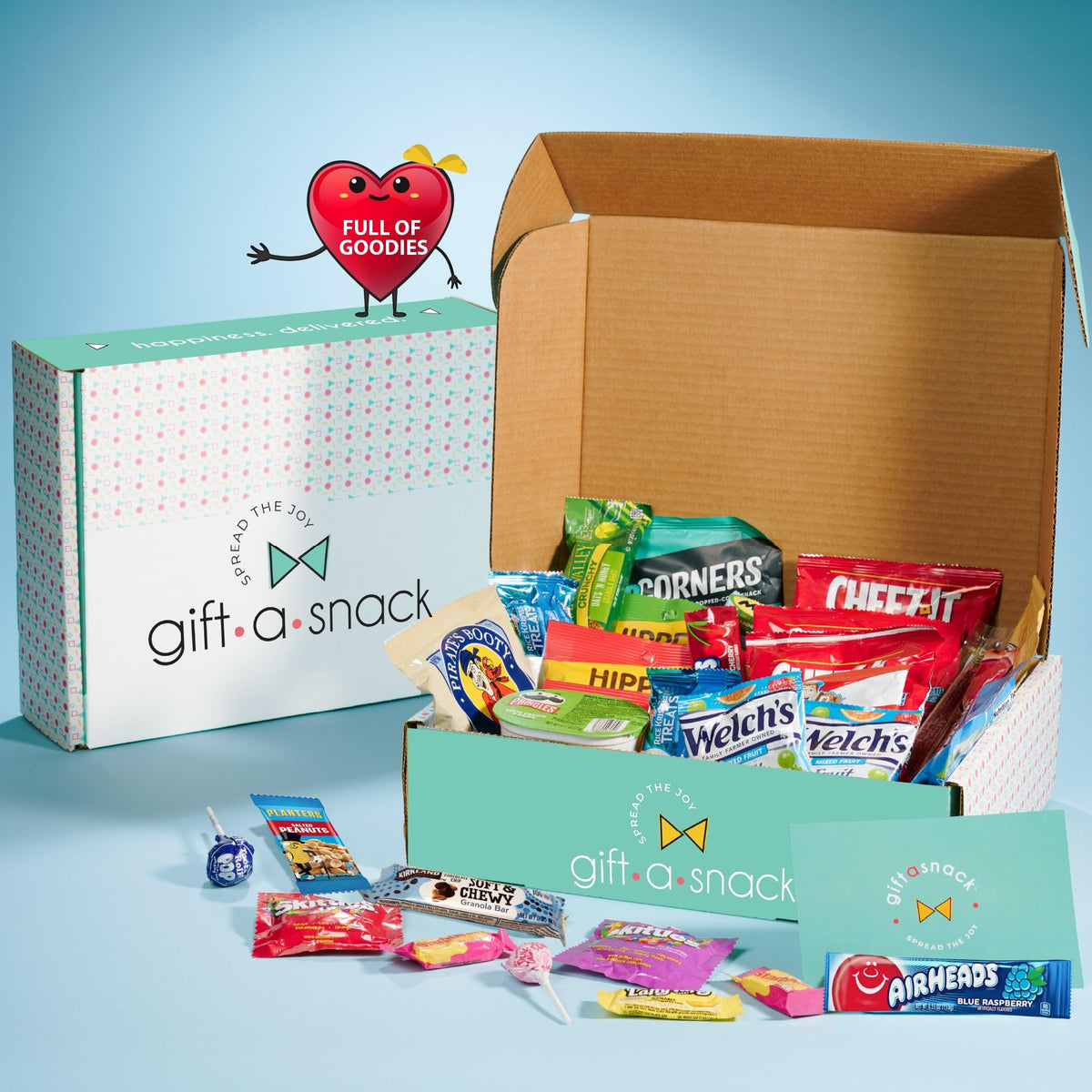 Nut Cravings Gift A Snack variety pack display with diverse snacks for sharing