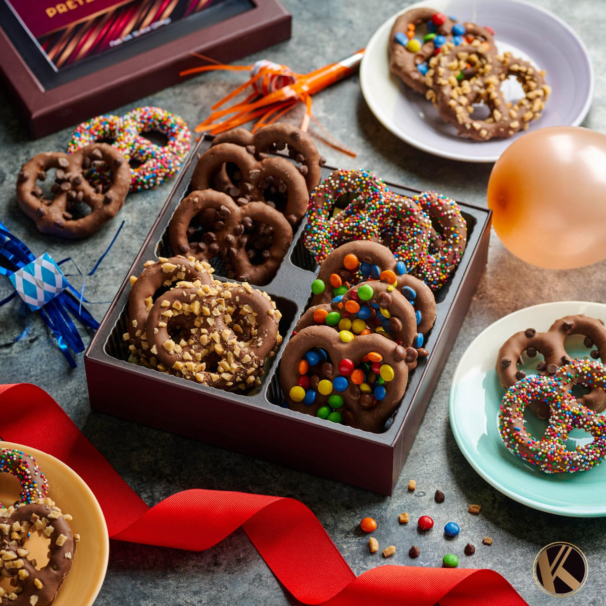 Nut Cravings KREMERY colored M&M toppings on pretzels create festive snacking