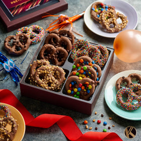 Nut Cravings KREMERY colored M&M toppings on pretzels create festive snacking