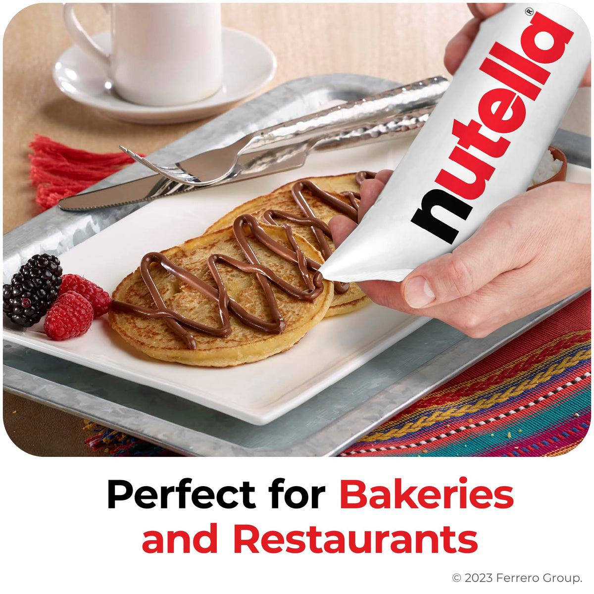 Nutella piping bag in a busy restaurant kitchen for dessert decoration.