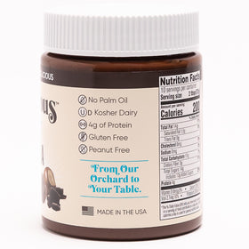 Nutlicious Hazelnut Dark Cocoa Spread pour showing smooth flow for toast.