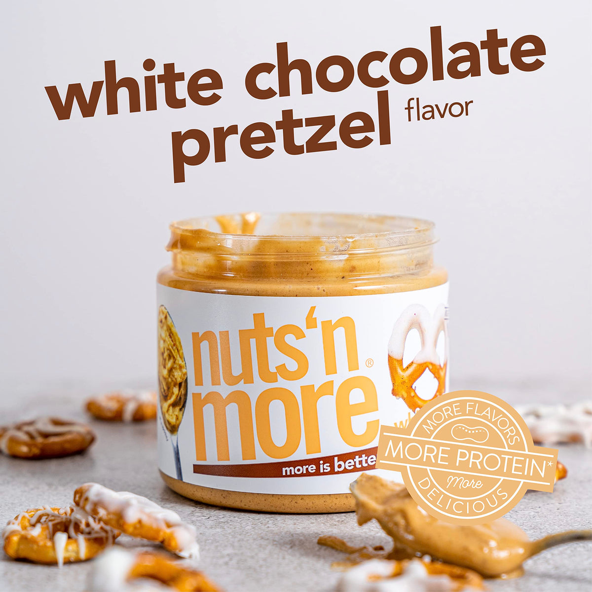 Nuts N More packaged jar on store shelf signals convenient, all-natural indulgence.