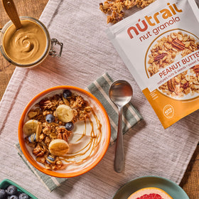 NuTrail granola topping a parfait, a versatile breakfast idea.