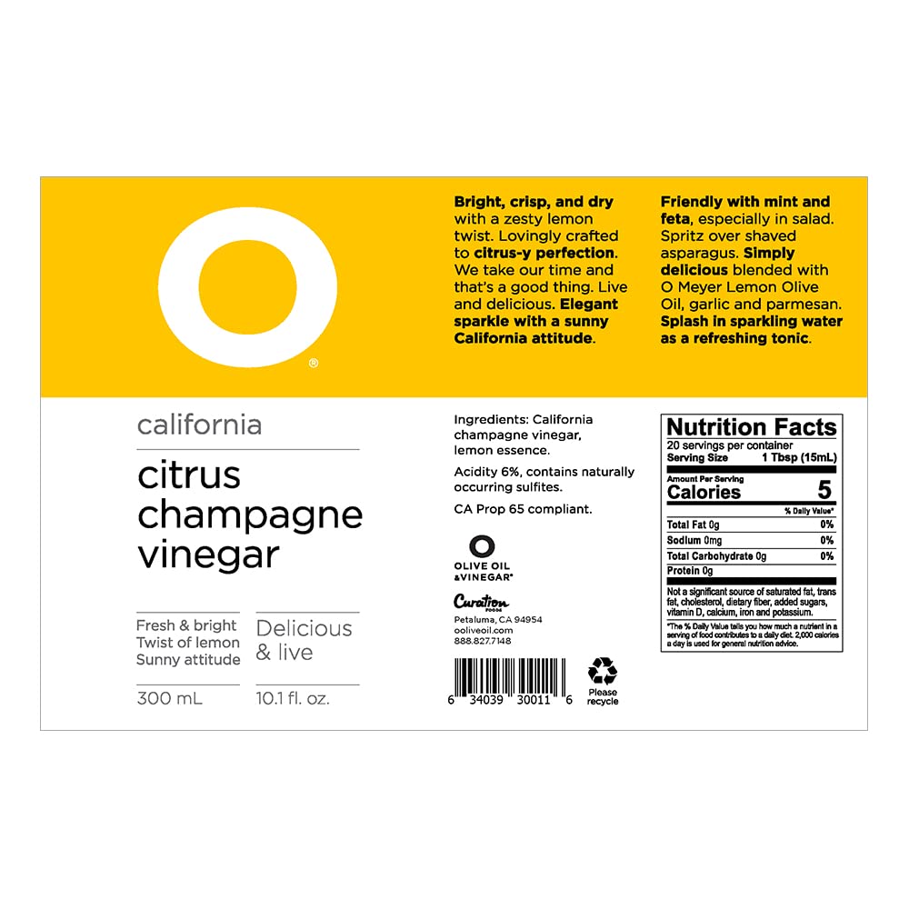 O Olive Oil Citrus Champagne Vinegar bottle on kitchen counter ready for salads and marinades.