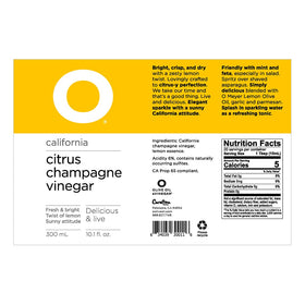 O Olive Oil Citrus Champagne Vinegar bottle on kitchen counter ready for salads and marinades.