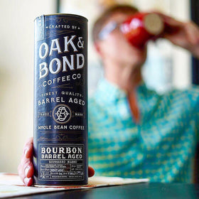 Oak & Bond gold-stamped canister preserves freshness for premium espresso.