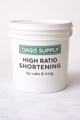 Oasis Supply Flex Cake Shortening bottle pour demonstrates controlled, mess-free usage for smooth batters.