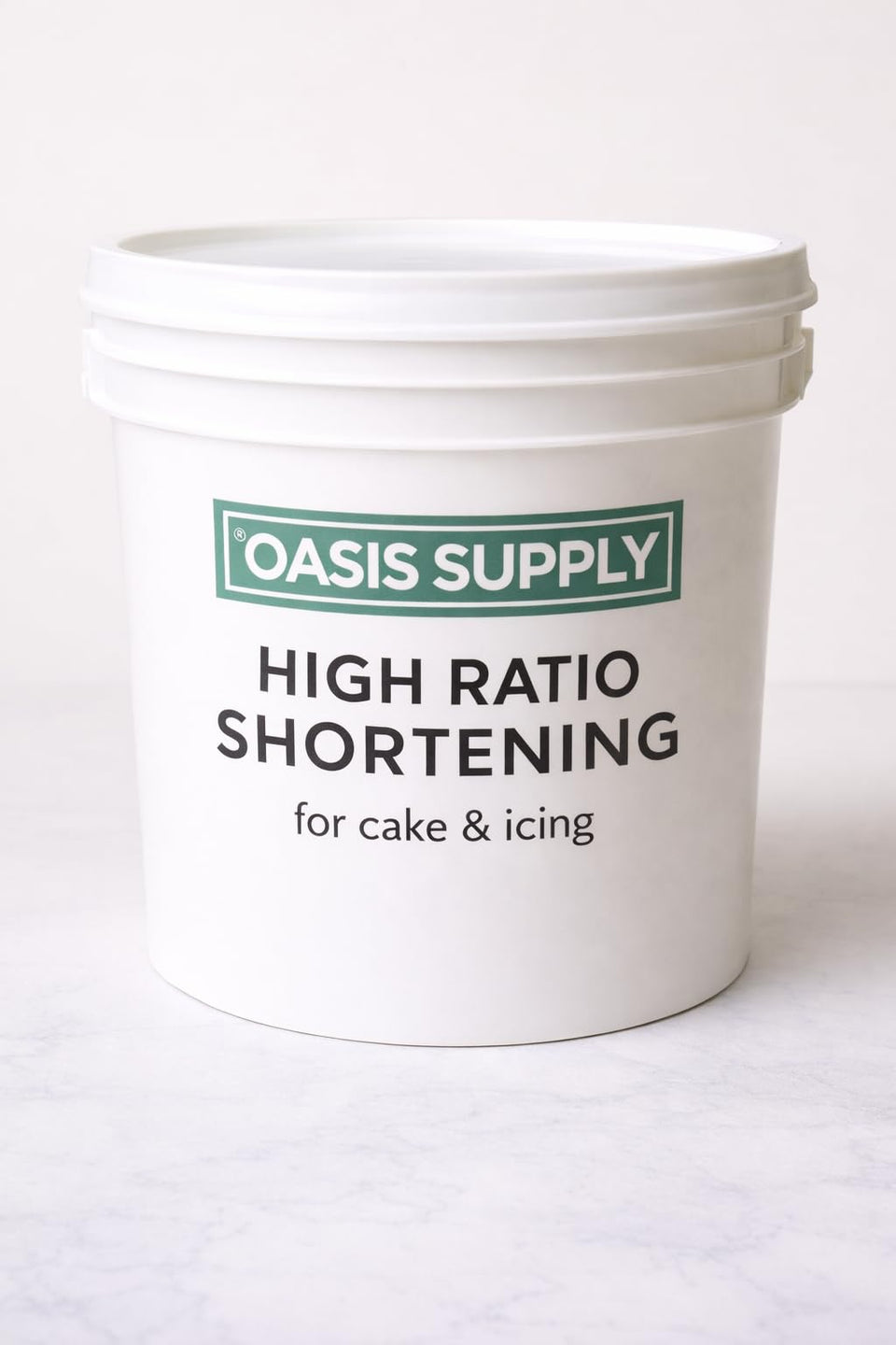 Oasis Supply Flex Cake Shortening bottle pour demonstrates controlled, mess-free usage for smooth batters.