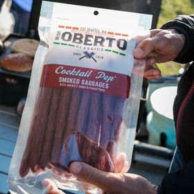 Oberto on-the-go snack image featuring resealable bag and portability.