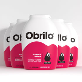 Obrilo water enhancer bottle pour demonstrates customizable hydration for everyday use.