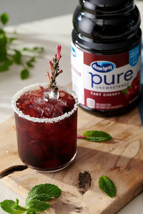 Ocean Spray Tart Cherry juice label closeup emphasizes 100% juice with no added sugar.