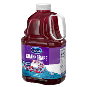 Ocean Spray Cran-Grape bottle on the kitchen counter with fruit nearby.