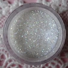 Oh! Sweet Art Rainbow Disco Dust on a cake enhances color and sparkle for decorating.