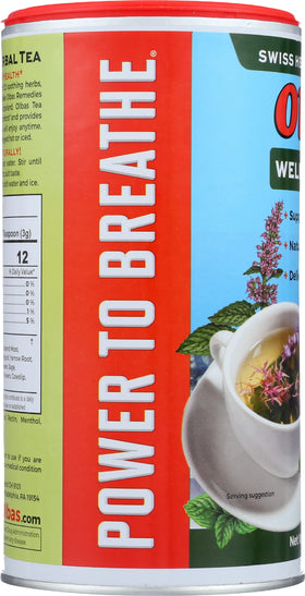 Olbas Herbal Tea Mix measuring spoon beside sachets for precise brewing.