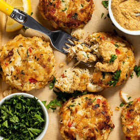 Pan-frying Old Bay Crab Cake Classic Mix patties on stove