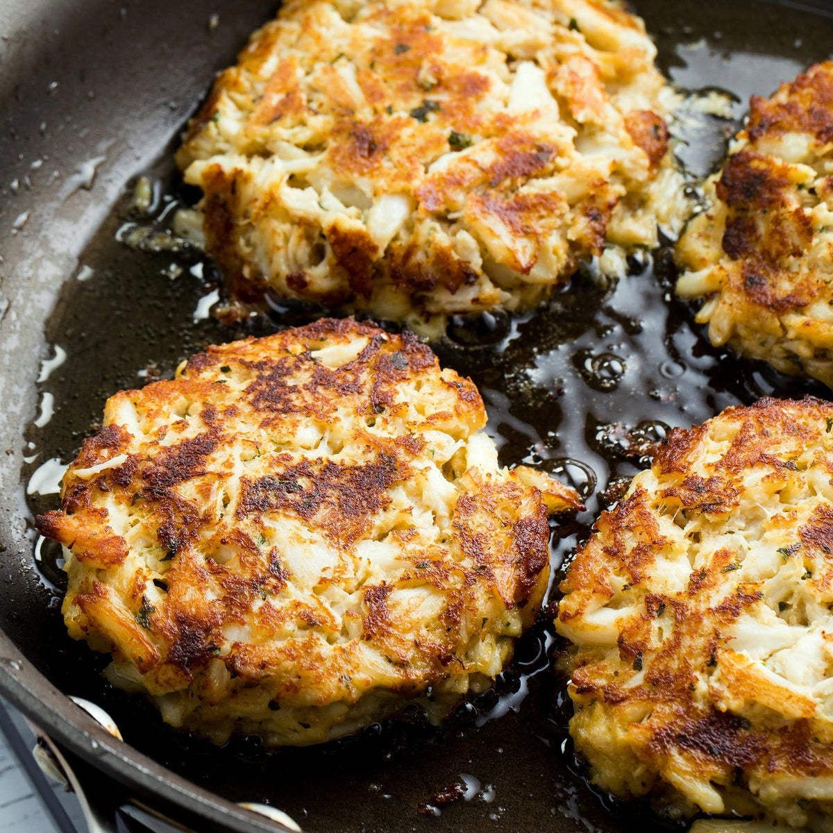 Preparing Old Bay Crab Cake Classic Mix with crab meat in a bowl