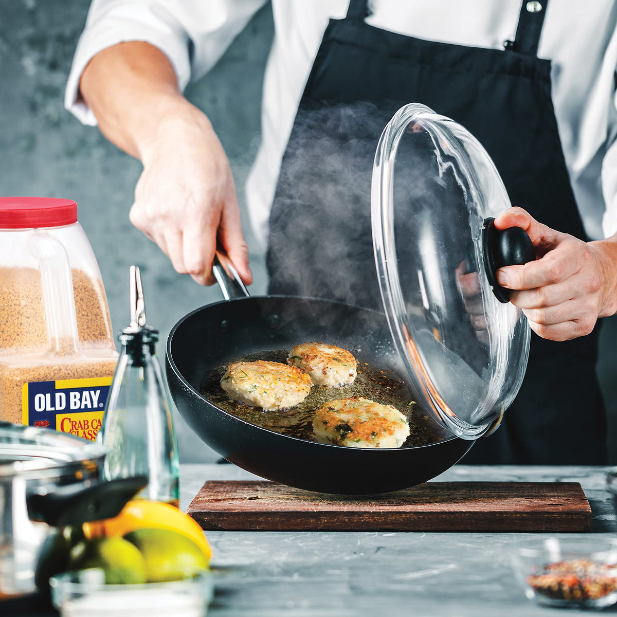 Crispy Old Bay crab cakes plated with lemon.