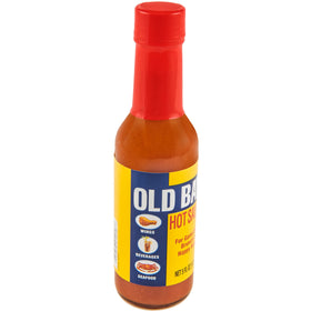 Close-up of OLD BAY Hot Sauce label highlighting premium herbs and peppers