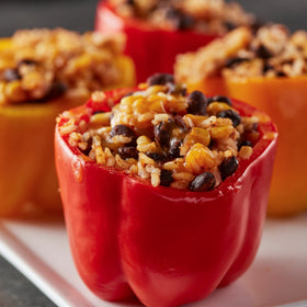 Old El Paso Cheesy Mexican Rice Mix steaming, fluffy grains ready in minutes.