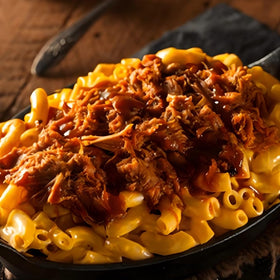 Old Hacienda Pulled BBQ Pork sandwich assembly featuring tender meat.