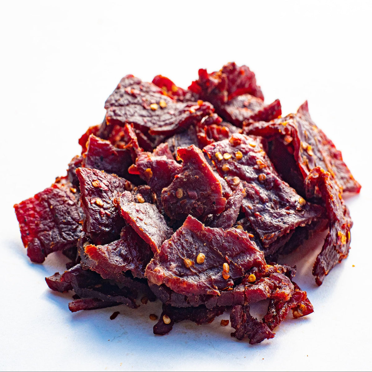 Close-up of Old Trapper jerky strips reveals tender texture and smoky finish