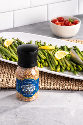 Olde Thompson California Garlic and Sea Salt Grinder pouring to season fish