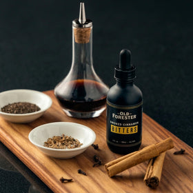 Old Forester Cinnamon Bitters ingredients closeup highlighting warm spice notes.