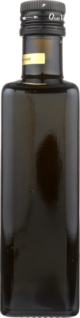Olio Verde bottle on a kitchen shelf ready for drizzle.