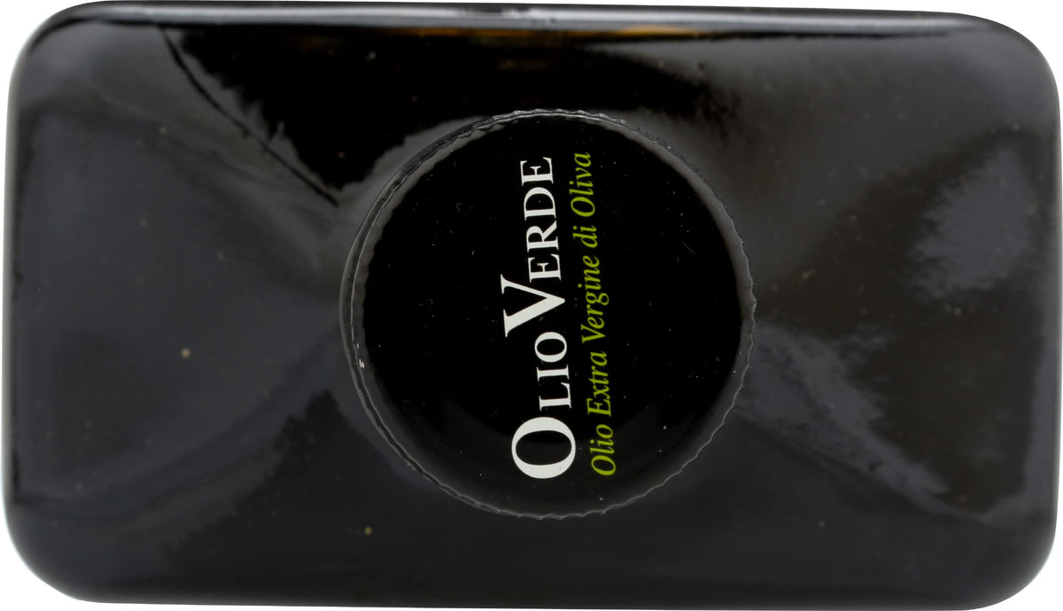 Olio Verde pouring olive oil over pasta or vegetables.