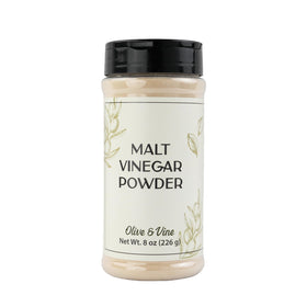 Olive & Vine Malt Vinegar Powder in a reusable shaker jar for garnishing meals.