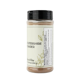 Pouring Olive & Vine Worcestershire Powder to deepen marinades and sauces.