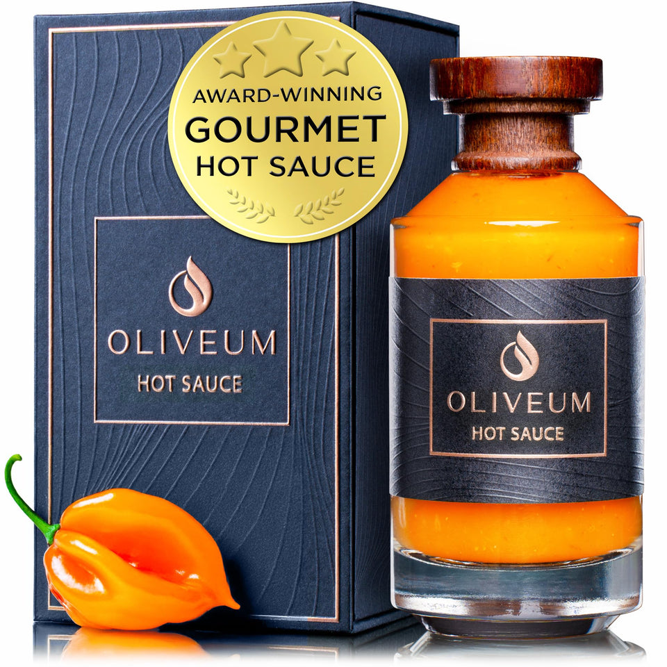 Oliveum hot sauce bottle top with walnut cap and copper medallion.