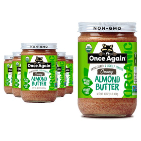 Once Again Almond Butter jar in glass showcasing creamy texture, ideal for toast or smoothies.