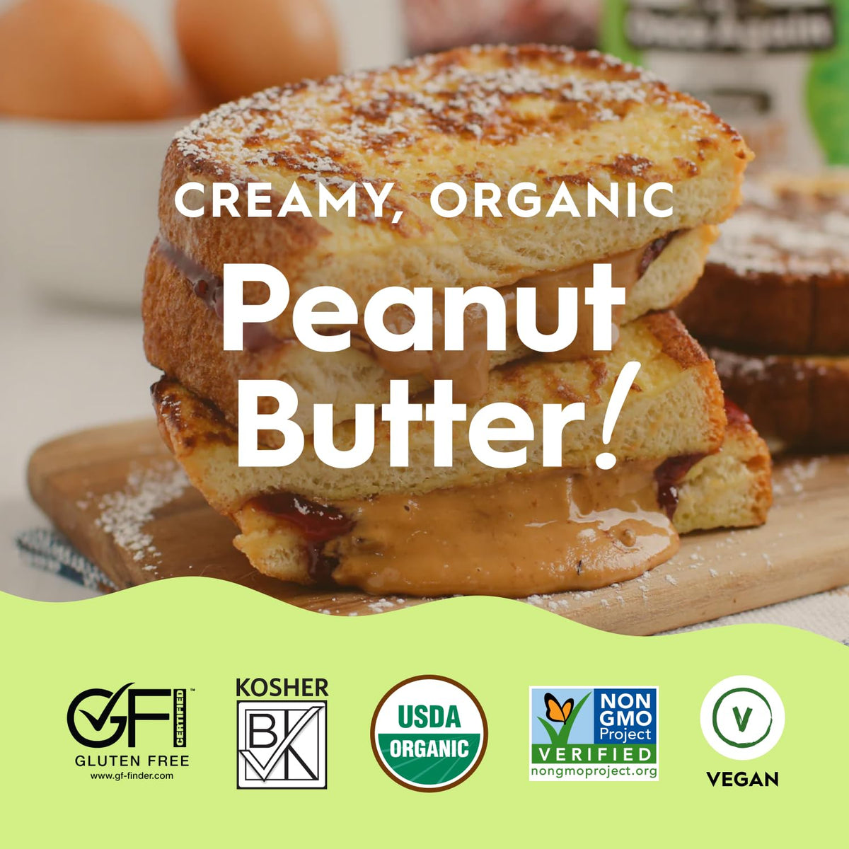 Spoon scooping Once Again peanut butter to showcase creamy texture.