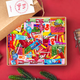 Close-up of ONE CANDY WAY assorted individually wrapped candies for clean sharing.