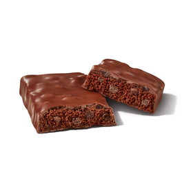 ONE Protein Bars Hershey's Double Chocolate on gym bag with workout gear