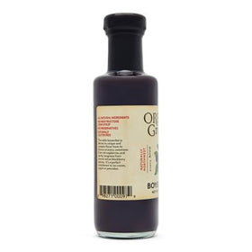 Oregon Growers Boysenberry Syrup poured over pancakes for vibrant breakfast flavor.